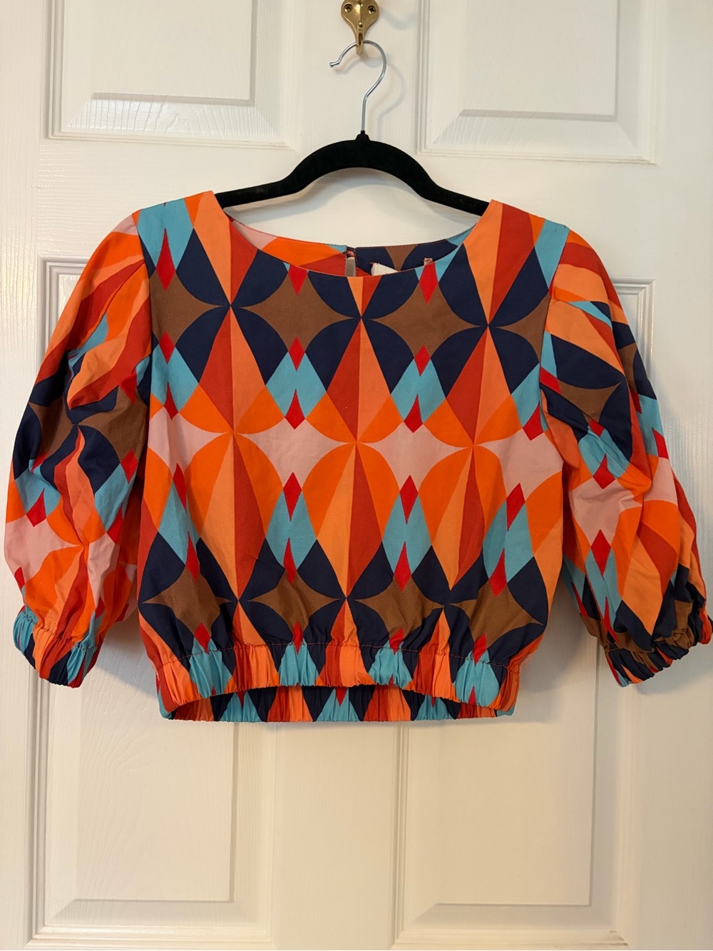 Maude Vivante Geometric Print Cropped Puff Sleeve Top in Orange & Blue